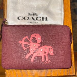 Coach Maroon Wristlet with Sagittarius design